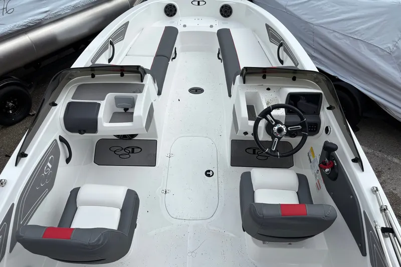 Slide: The Image of 2026 Tahoe T21 boat interior with dual seating, steering wheel, and modern dashboard. - 6