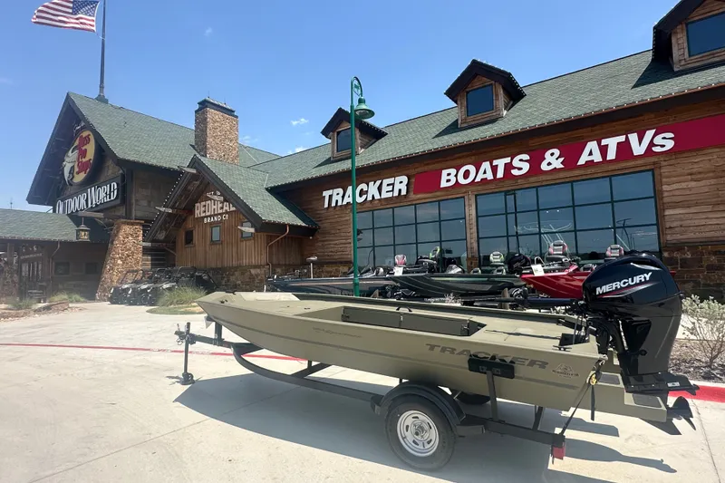 The Image of 2026 Tracker Grizzly 1654 T Sportsman boat outside Tracker Boats & ATVs store. - 1