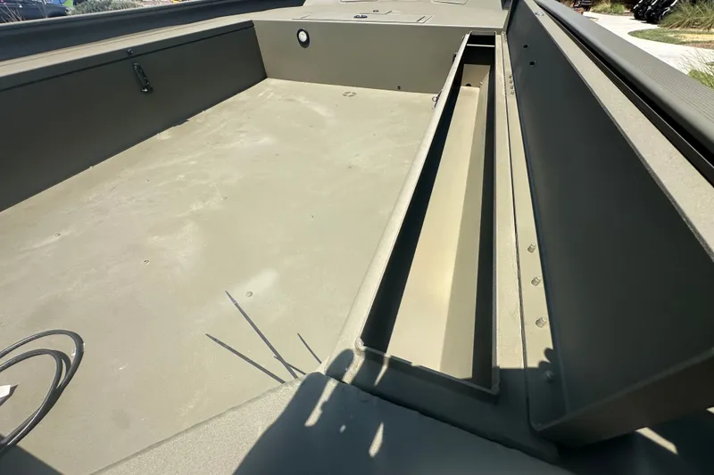 Slide: The Image of Interior view of 2026 Tracker Grizzly 1654 T Sportsman boat, showcasing spacious storage compartments. - 14