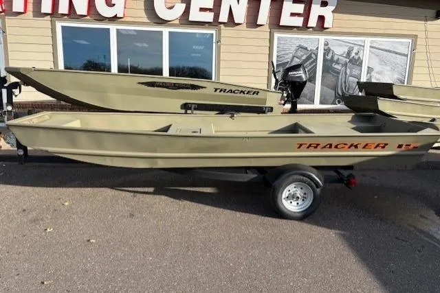 The Image of 2026 Tracker Grizzly 15 Jon boat displayed outside a boating center. - 0