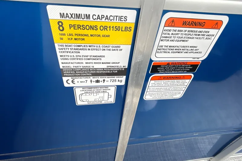 Slide: The Image of Capacity and warning labels on 2026 Sun Tracker Party Barge 16 DLX boat. - 30
