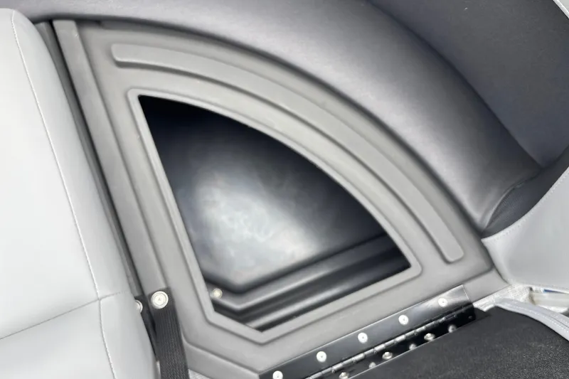 Slide: The Image of 2026 Sun Tracker Party Barge 16 DLX interior storage compartment detail. - 22