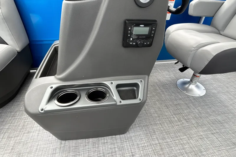 Slide: The Image of Interior of 2026 Sun Tracker Party Barge 16 DLX with cup holders and control panel. - 20