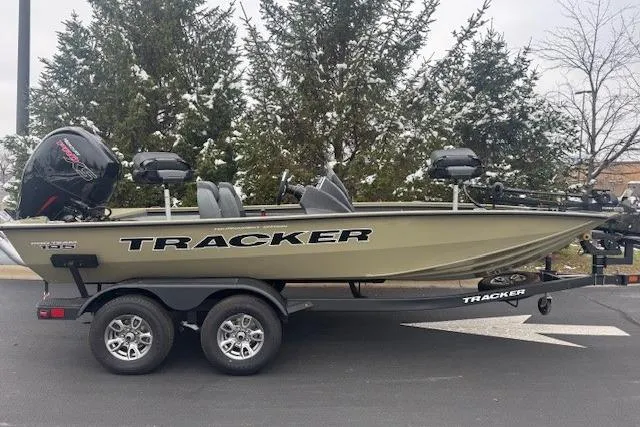 The Image of 2026 Tracker Pro Team 195 boat on trailer, parked outdoors. - 0