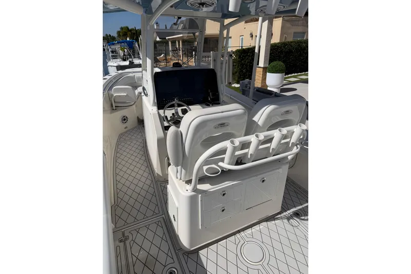 Slide: The Image of 2021 Cobia 262 Center Console boat interior with helm and seating area. - 10
