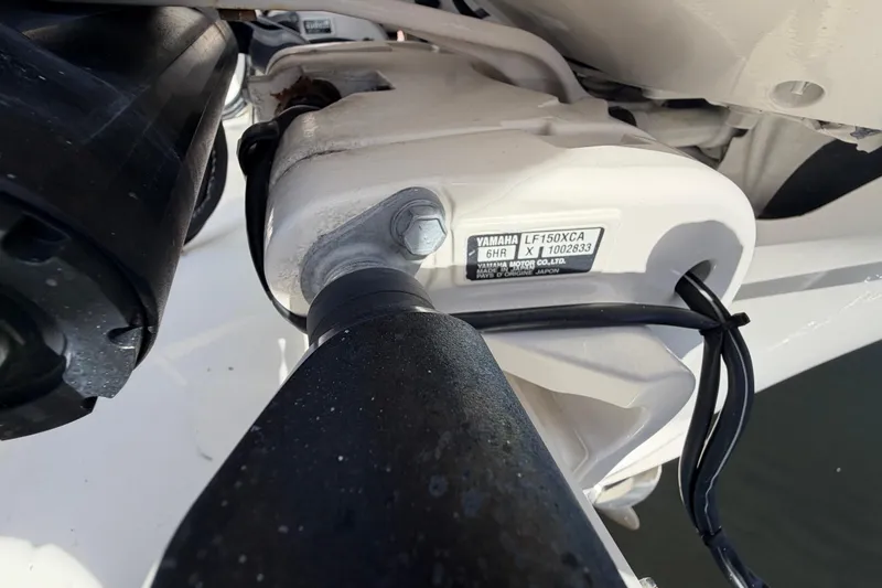 Slide: The Image of Close-up of Yamaha LF150XCA engine on 2021 Cobia 262 Center Console boat. - 25