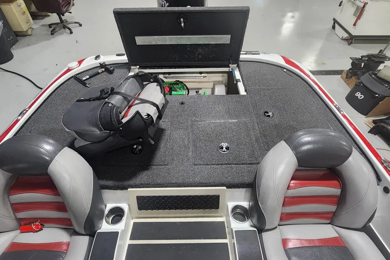 Slide: The Image of 2011 Nitro Z-8 boat interior with storage compartment and backpack on deck. - 11
