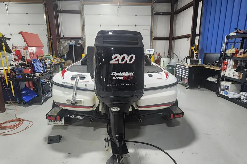Slide: The Image of 2011 Nitro Z-8 boat with OptiMax Pro XS 200 engine in a garage. - 3