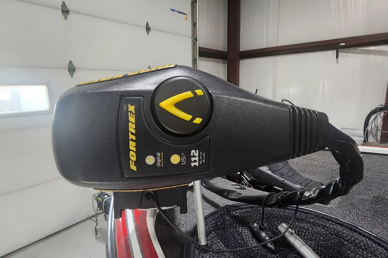 Slide: The Image of Close-up of Fortrex trolling motor on 2011 Nitro Z-8 boat in a garage. - 5