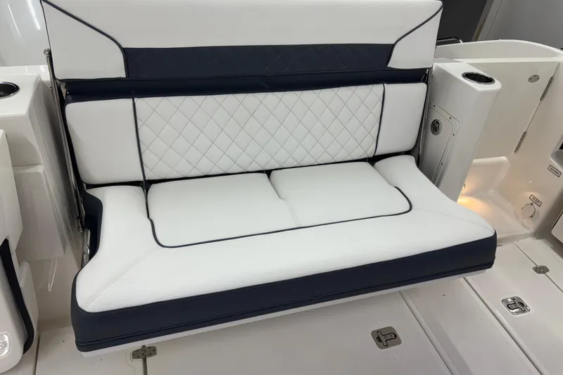 Slide: The Image of 2020 Pursuit DC 365 Dual Console boat seat with white and navy upholstery. - 19