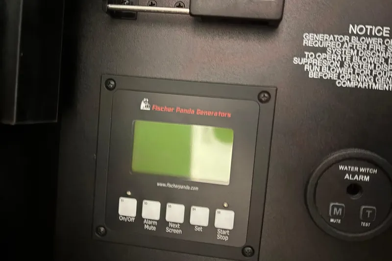 Slide: The Image of Control panel of Fischer Panda generator on 2020 Pursuit DC 365 Dual Console boat. - 29