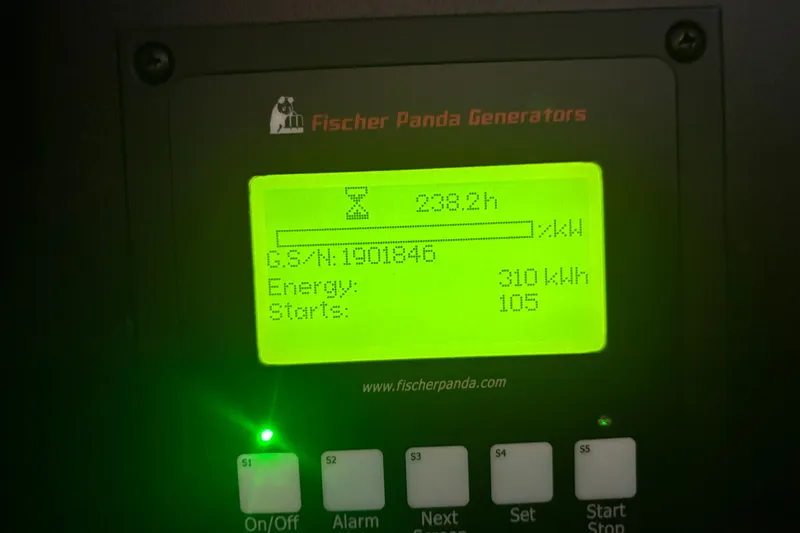 Slide: The Image of Fischer Panda generator display showing 238.2 hours, 310 kWh energy, 105 starts. - 30