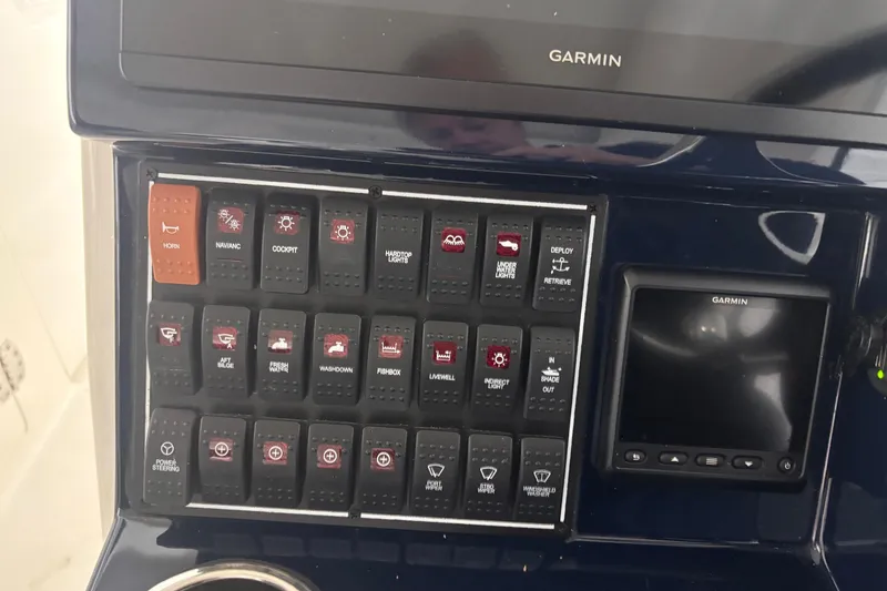 Slide: The Image of Control panel of 2020 Pursuit DC 365 Dual Console boat with Garmin display. - 31