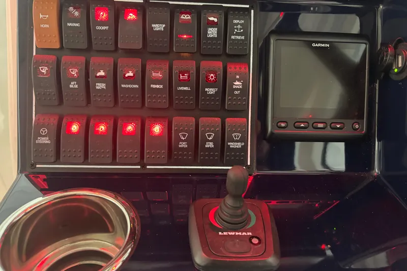 Slide: The Image of Control panel of 2020 Pursuit DC 365 Dual Console with switches and Garmin display. - 32