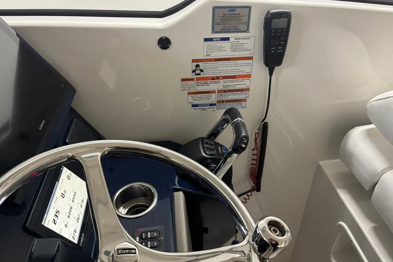 Slide: The Image of 2020 Pursuit DC 365 Dual Console helm with steering wheel, controls, and display. - 35