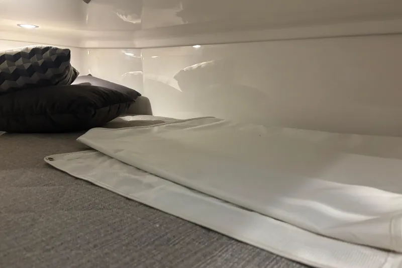 Slide: The Image of Interior cabin of 2020 Pursuit DC 365 Dual Console with pillows and bedding. - 37