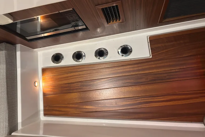 Slide: The Image of Interior of 2020 Pursuit DC 365 Dual Console with wood paneling and lighting. - 42