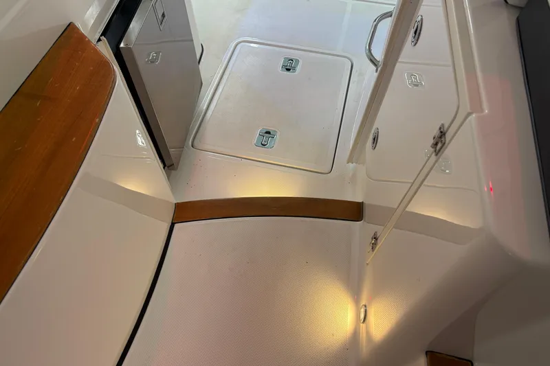 Slide: The Image of 2020 Pursuit DC 365 Dual Console interior with storage compartments and sleek design. - 46