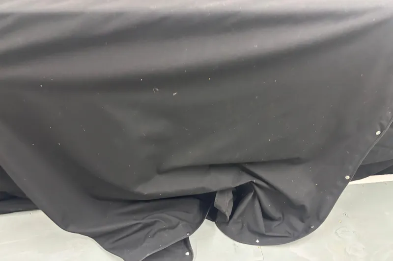 Slide: The Image of Black cover on a 2020 Pursuit DC 365 Dual Console boat. - 57