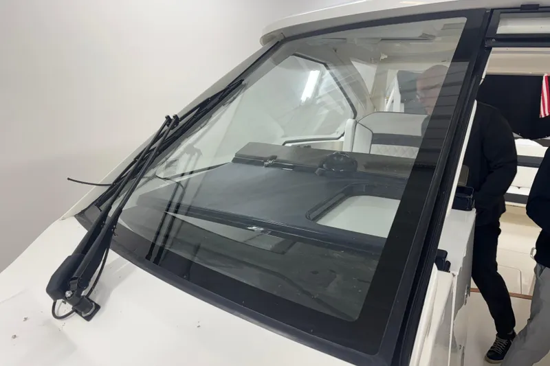 Slide: The Image of 2020 Pursuit DC 365 Dual Console boat windshield and interior view. - 59