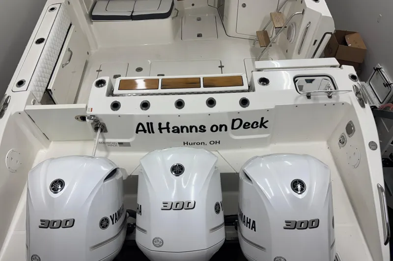 Slide: The Image of 2020 Pursuit DC 365 Dual Console boat with triple Yamaha 300 engines, "All Hanns on Deck." - 64