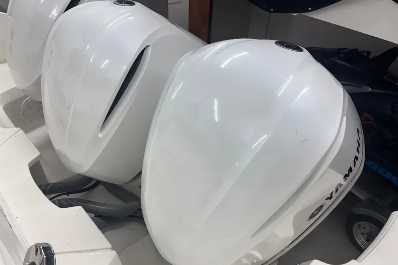 Slide: The Image of Yamaha outboard engines on a 2020 Pursuit DC 365 Dual Console boat. - 65