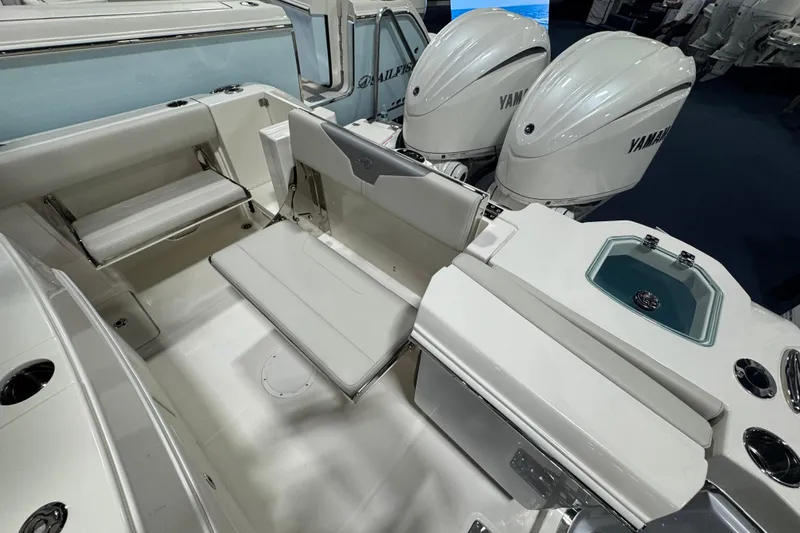 Slide: The Image of 2026 Sailfish 272 CC boat interior with Yamaha engines and seating area. - 3