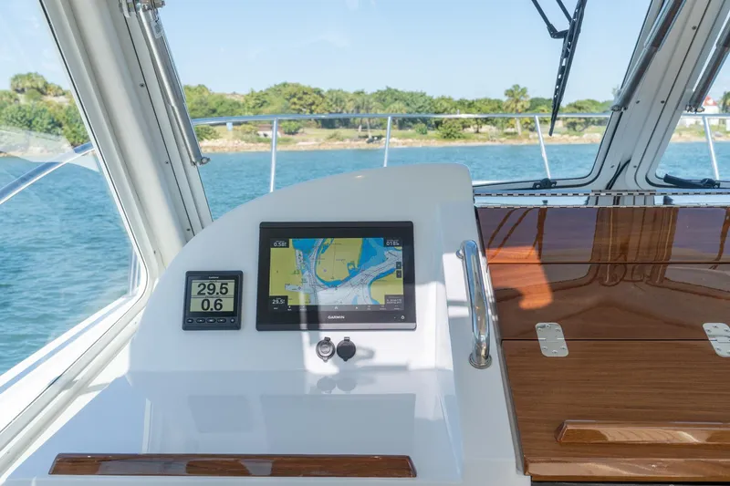 Slide: The Image of Helm of 2025 MJM 35 boat with navigation display and speedometer. - 19