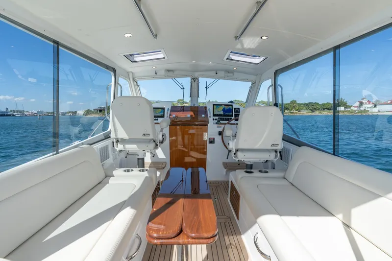 Slide: The Image of Luxurious interior of 2025 MJM 35 yacht with panoramic windows and plush seating. - 20