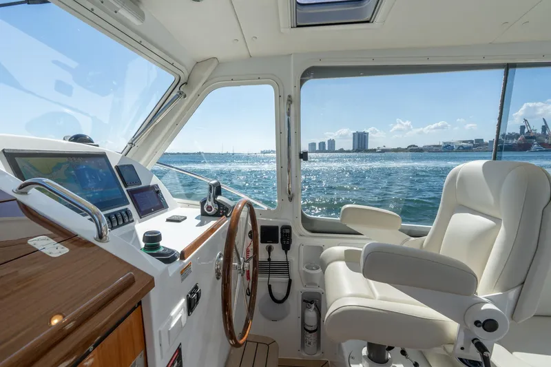 Slide: The Image of Helm of 2025 MJM 35 boat with ocean view and modern controls. - 22