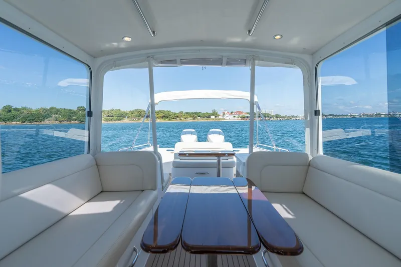 Slide: The Image of Interior view of 2025 MJM 35 yacht with elegant seating and scenic ocean backdrop. - 27