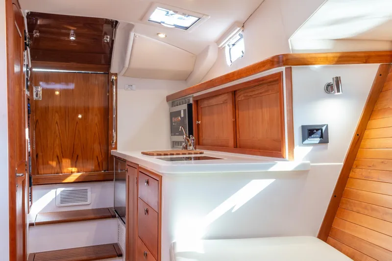 Slide: The Image of Luxurious interior of 2025 MJM 35 yacht featuring elegant wood finishes and modern amenities. - 36