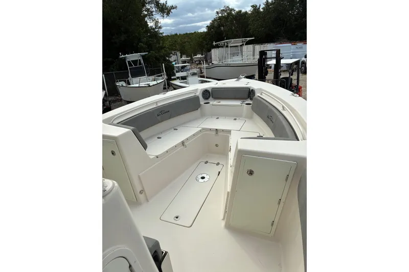 Slide: The Image of 2023 Sea Chaser 27 HFC CC boat interior with seating and storage compartments. - 7