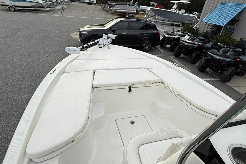 Slide: The Image of 2015 Sea Fox 200 Viper boat with spacious deck, parked near vehicles and ATVs. - 12
