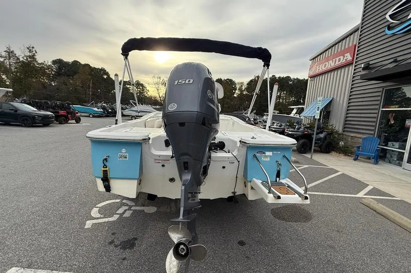 Slide: The Image of 2015 Sea Fox 200 Viper boat with Yamaha 150 engine in parking lot. - 4