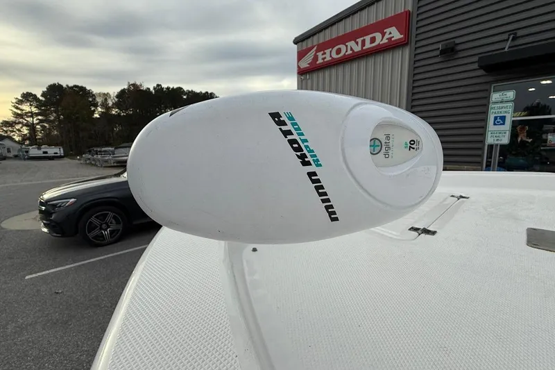 Slide: The Image of Minn Kota Riptide motor on 2015 Sea Fox 200 Viper near Honda dealership. - 7