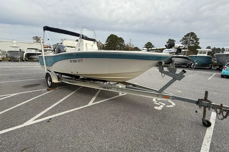 Slide: The Image of 2015 Sea Fox 200 Viper boat on trailer in parking lot, overcast sky. - 8