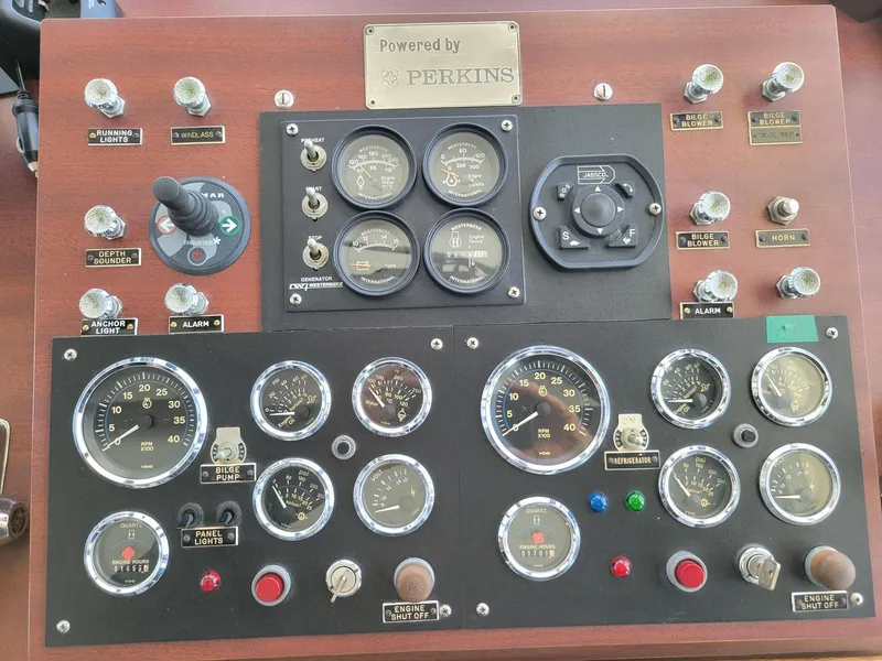Slide: The Image of Control panel of a 1987 Custom Pilgrim Tribute boat with Perkins engine gauges and switches. - 19