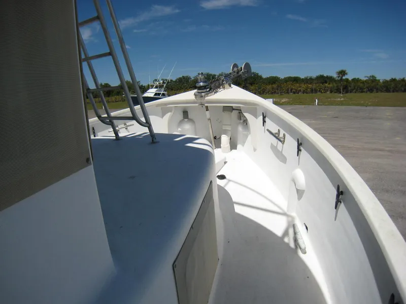 Slide: The Image of 1987 Custom Pilgrim Tribute boat deck with clear sky and distant trees. - 28