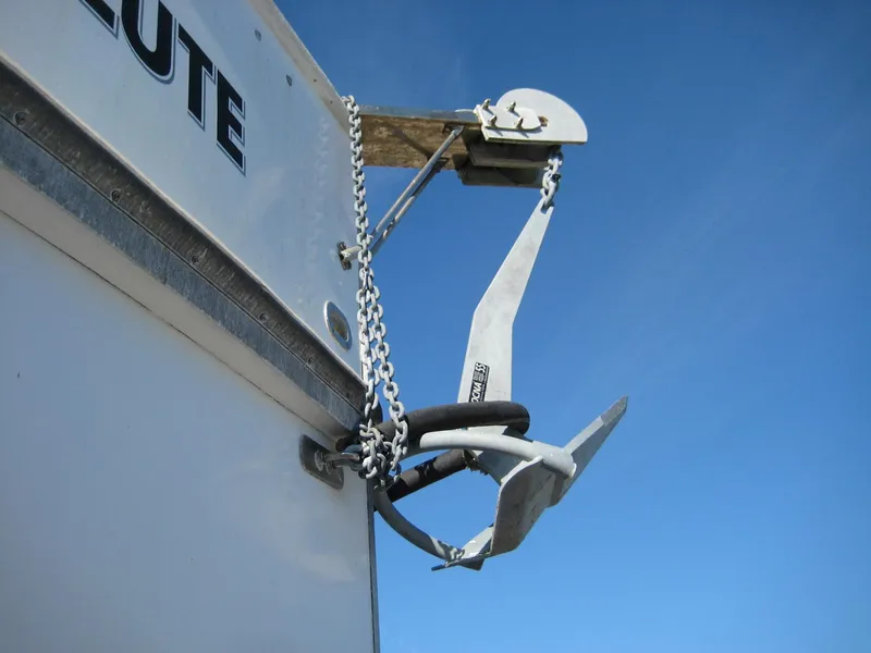Slide: The Image of Anchor on 1987 Custom Pilgrim Tribute boat against clear blue sky. - 30
