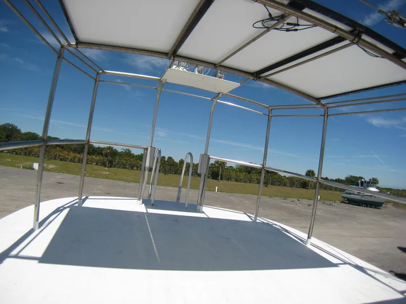 Slide: The Image of Open deck of 1987 Custom Pilgrim Tribute boat with metal frame and canopy. - 34