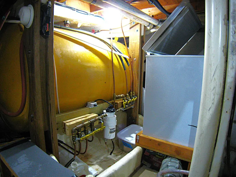 Slide: The Image of Engine room of 1987 Custom Pilgrim Tribute with yellow tank and machinery. - 48