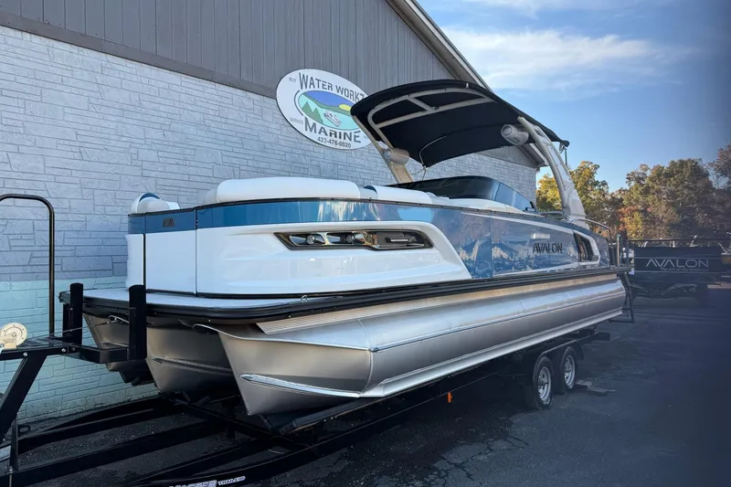 Slide: The Image of 2026 Avalon 2585 Excalibur LTD Flex Windshield pontoon boat on trailer at Water Works Marine. - 1