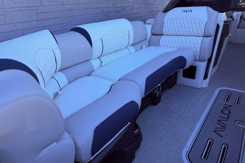 Slide: The Image of Luxurious seating on 2026 Avalon 2585 Excalibur LTD Flex Windshield boat, featuring elegant upholstery. - 10
