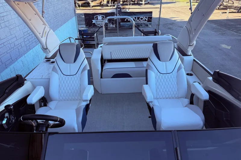 Slide: The Image of 2026 Avalon 2585 Excalibur LTD Flex Windshield boat interior with luxurious seating. - 11