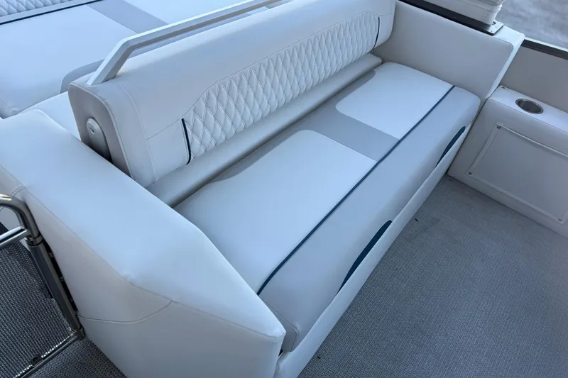 Slide: The Image of Luxurious seating on 2026 Avalon 2585 Excalibur LTD Flex Windshield boat, featuring elegant white upholstery. - 15