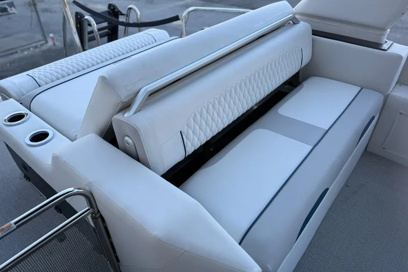 Slide: The Image of Luxurious seating on 2026 Avalon 2585 Excalibur LTD Flex Windshield boat, featuring cup holders. - 16