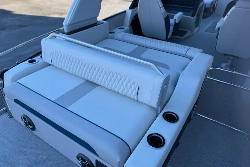 Slide: The Image of 2026 Avalon 2585 Excalibur LTD Flex Windshield boat interior with luxurious seating and cup holders. - 20
