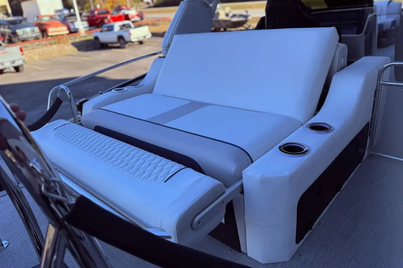 Slide: The Image of Luxurious seating on 2026 Avalon 2585 Excalibur LTD Flex Windshield boat, featuring cup holders. - 23