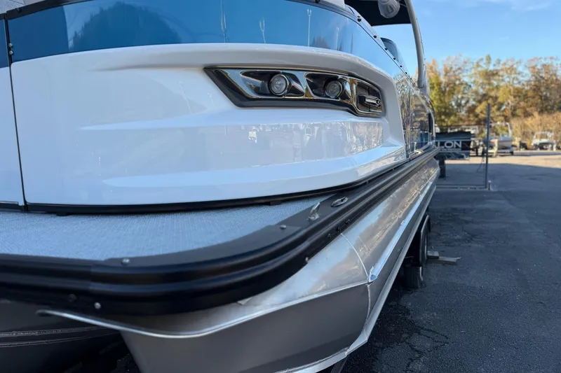 Slide: The Image of 2026 Avalon 2585 Excalibur LTD Flex Windshield boat, sleek design, close-up view. - 3